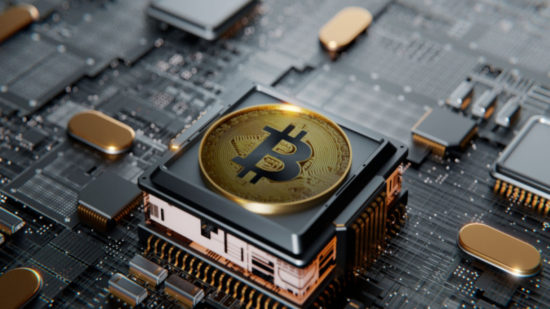 Bitcoin over a microprocessor in a motherboard-Shutterstock_1985279114